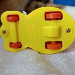 Rabbit in car w basketball game in back..